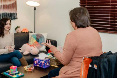 Adult patient during a psychological evaluation session for ADHD in Tucson, discussing attention, memory, and daily functioning concerns with a mental health provider.