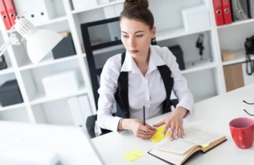 Worker managing stress with cbt tools Worker at office managing stress with CBT tools