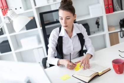 Worker at office managing stress with CBT tools