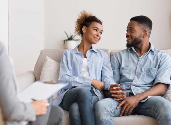 Loving Black Couple Visiting Therapy Session At Psychologist's Office Loving black couple visiting couples therapy therapist in Tucson