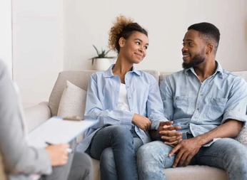 loving-black-couple-visiting-couples-therapy-therapist Couple into a couples therapy sessionin Tucson